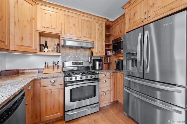 27711 Moffat Rd, Evergreen, CO 80439 - kitchen with light wood-style floors, appliances with stainless steel finishes, open shelves, and under cabinet range hood