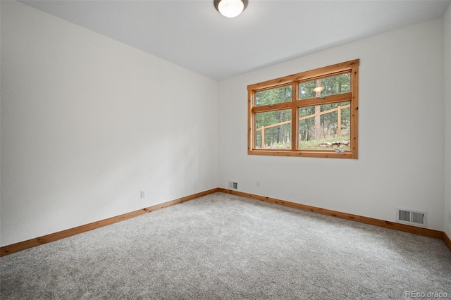 27711 Moffat Rd, Evergreen, CO 80439 - empty room featuring visible vents, baseboards, and carpet floors