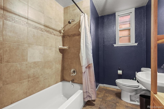 full bathroom with sink, shower / tub combo with curtain, a textured ceiling, and toilet