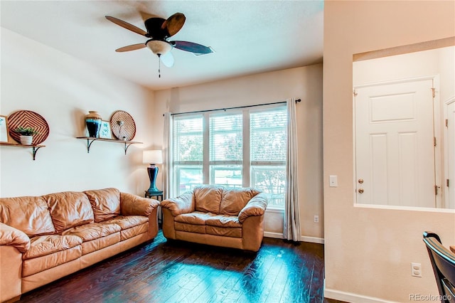 2346 Central Park Blvd, Denver, CO 80238 - living area featuring dark wood-style floors, ceiling fan, and baseboards