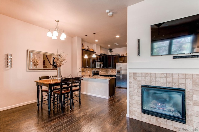 2346 Central Park Blvd, Denver, CO 80238 - dining area featuring dark wood-type flooring, a chandelier, baseboards, and recessed lighting