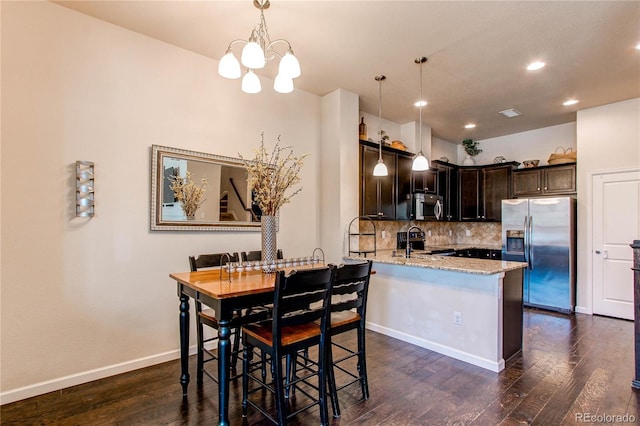 2346 Central Park Blvd, Denver, CO 80238 - dining space featuring dark wood-type flooring, a chandelier, baseboards, and recessed lighting