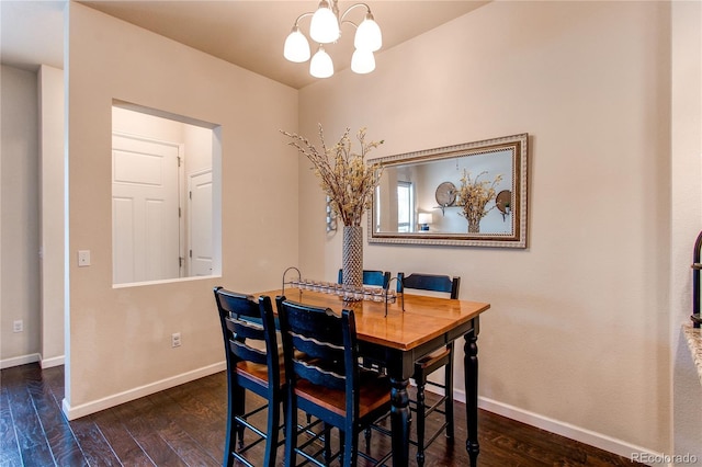 2346 Central Park Blvd, Denver, CO 80238 - dining space featuring a chandelier, wood finished floors, and baseboards