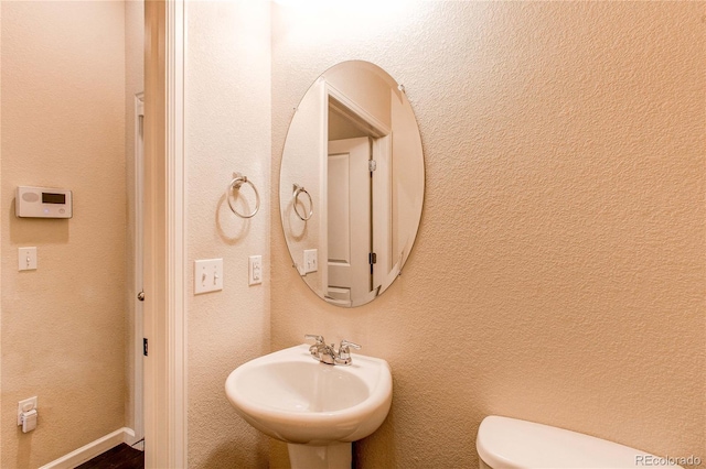 2346 Central Park Blvd, Denver, CO 80238 - half bathroom featuring a sink and toilet