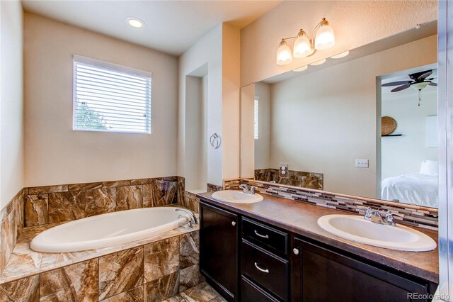 2346 Central Park Blvd, Denver, CO 80238 - bathroom with ensuite bathroom, a bath, double vanity, and ceiling fan