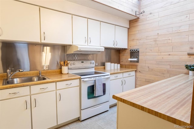 kitchen featuring a sink, light countertops, under cabinet range hood, and white electric stove