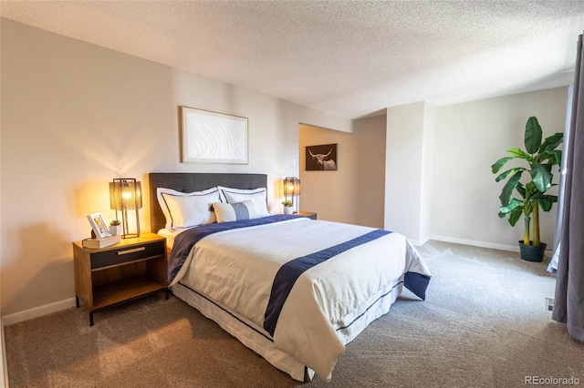 bedroom featuring baseboards, carpet floors, and a textured ceiling