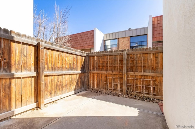 view of patio / terrace featuring fence