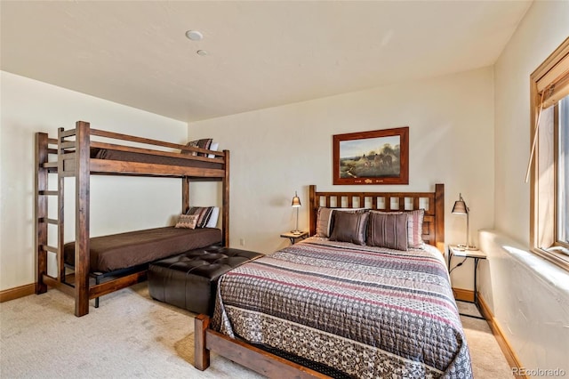 bedroom with light colored carpet