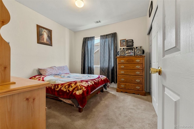 bedroom featuring light carpet