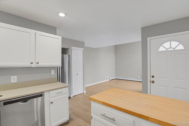 kitchen with a baseboard heating unit, white cabinetry, light wood-style floors, appliances with stainless steel finishes, and baseboards