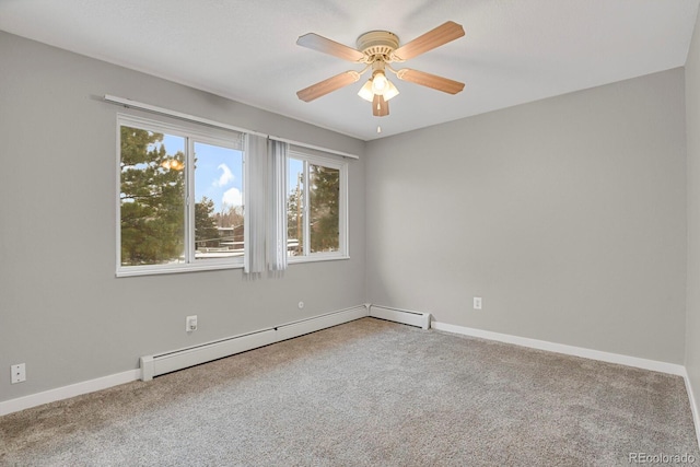 carpeted spare room with baseboards, baseboard heating, and ceiling fan