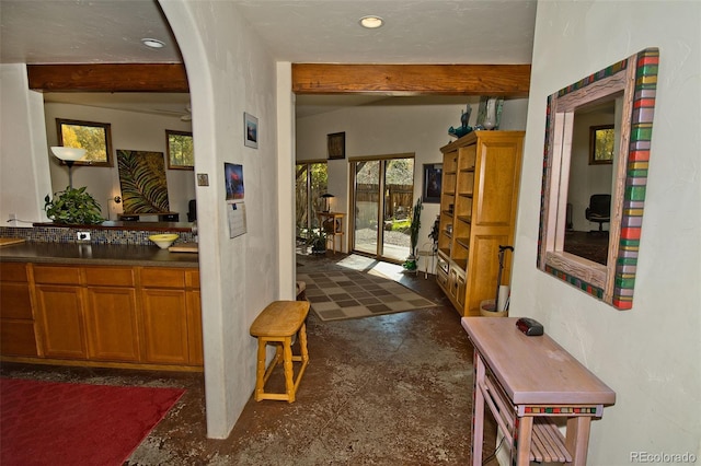 hallway featuring beamed ceiling