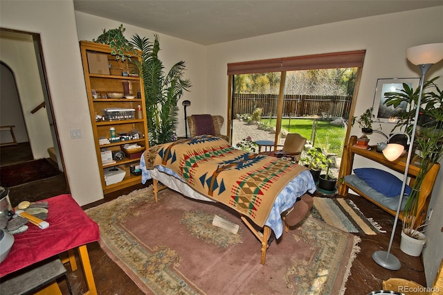 bedroom with dark hardwood / wood-style floors