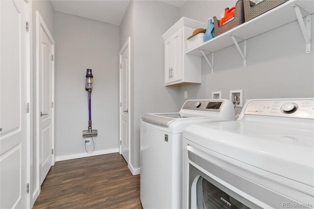 laundry room with dark wood-type flooring, cabinet space, independent washer and dryer, and baseboards