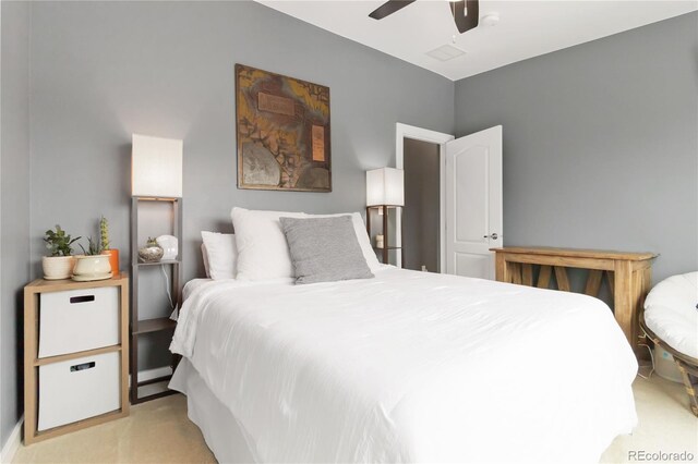 bedroom featuring light carpet and ceiling fan