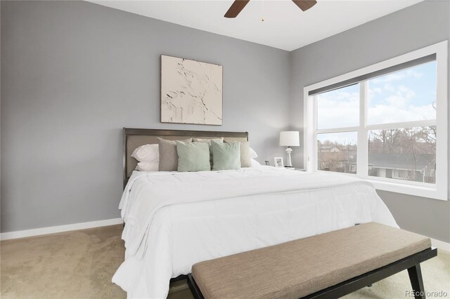 bedroom featuring carpet floors, baseboards, and a ceiling fan