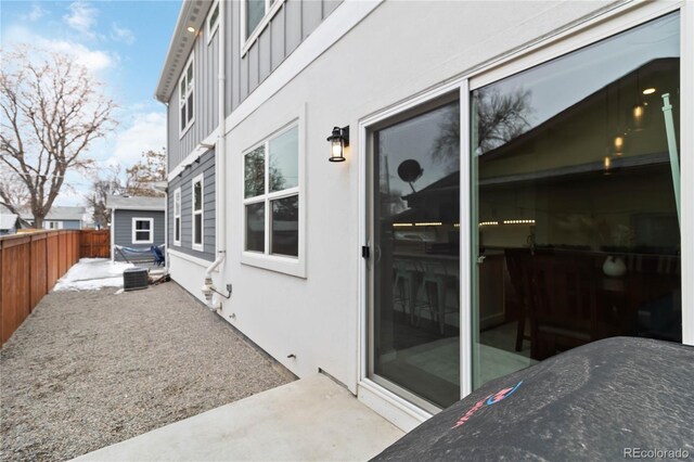 view of patio featuring fence