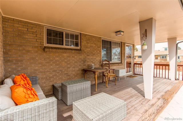 wooden deck featuring an outdoor hangout area