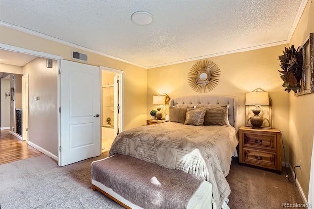 carpeted bedroom with a textured ceiling, visible vents, and crown molding