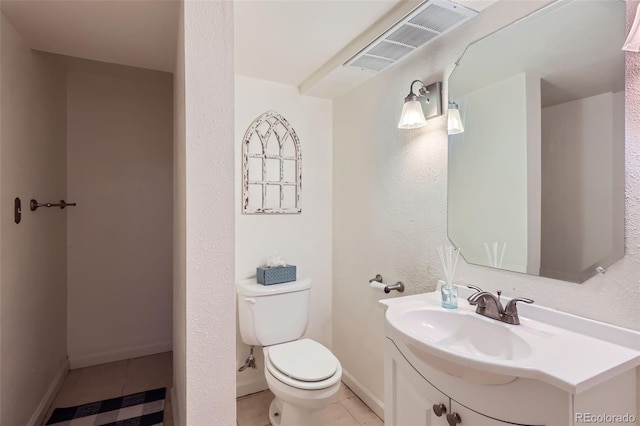 half bath featuring baseboards, visible vents, toilet, tile patterned floors, and vanity