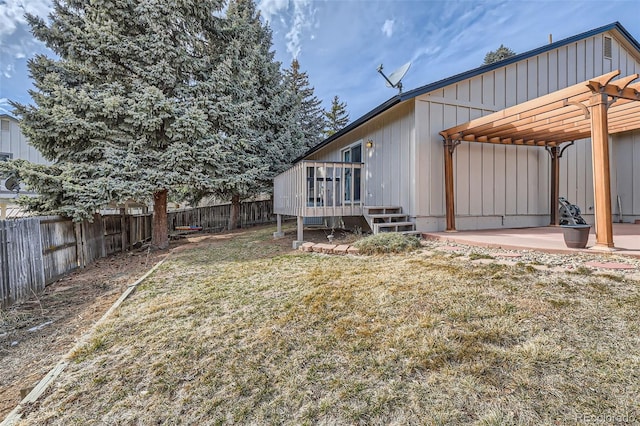 exterior space with a lawn, a patio area, a pergola, a fenced backyard, and a wooden deck