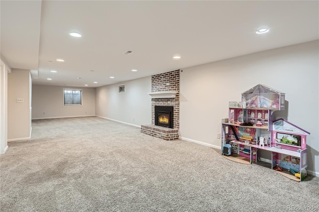 interior space featuring a fireplace, baseboards, carpet flooring, and recessed lighting