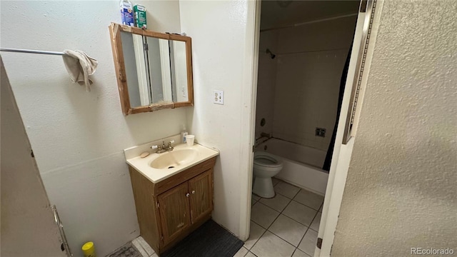 full bathroom featuring vanity, tile patterned flooring, bathtub / shower combination, and toilet