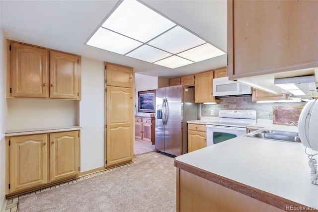 14050 E Linvale Pl Unit 601, Aurora, CO 80014 - kitchen featuring white appliances, light brown cabinetry, light countertops, and tasteful backsplash