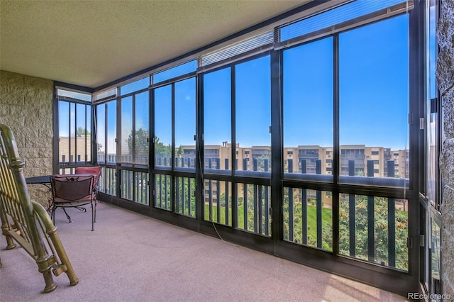 14050 E Linvale Pl Unit 601, Aurora, CO 80014 - sunroom / solarium featuring carpet floors, plenty of natural light, and a textured ceiling