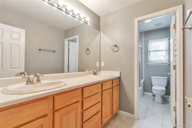29852 E 163rd Pl, Brighton, CO 80603 - bathroom featuring double vanity, tile patterned flooring, and shower / bath combination with glass door