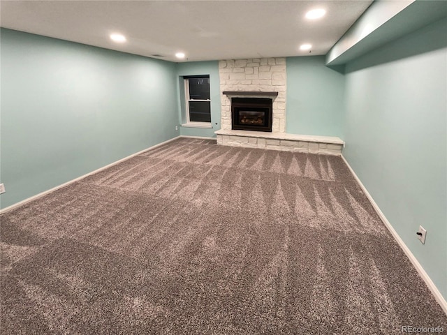 unfurnished living room featuring a fireplace and carpet floors