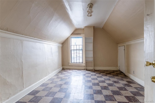 additional living space with lofted ceiling