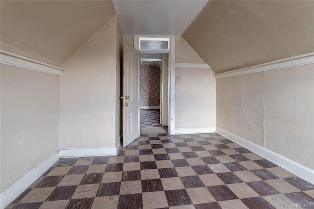 additional living space featuring lofted ceiling