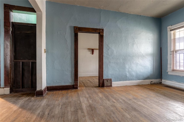 empty room featuring wood-type flooring