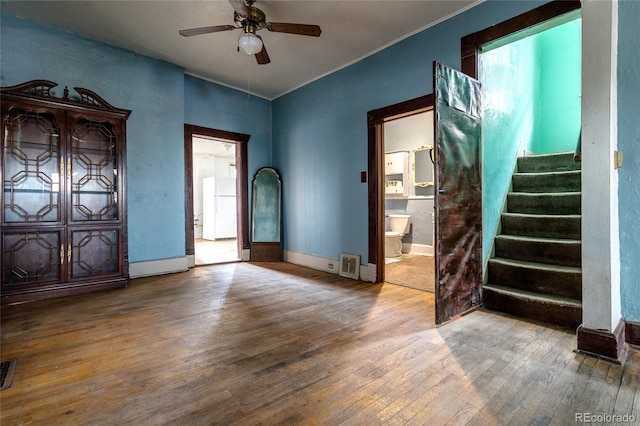 entrance foyer featuring ceiling fan and wood-type flooring