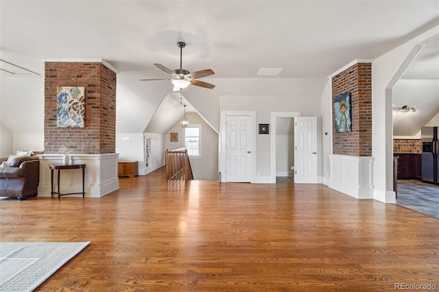 7996 Bradburn Blvd, Westminster, CO 80030 - unfurnished living room with ceiling fan, lofted ceiling, wood finished floors, and wainscoting