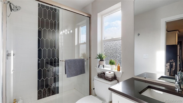 4457 Xavier St, Denver, CO 80212 - bathroom with a stall shower, vanity, and toilet