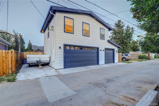 4457 Xavier St, Denver, CO 80212 - view of front facade with an attached garage and concrete driveway