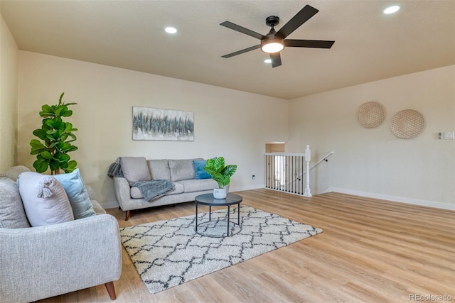 living room featuring recessed lighting, baseboards, wood finished floors, and ceiling fan