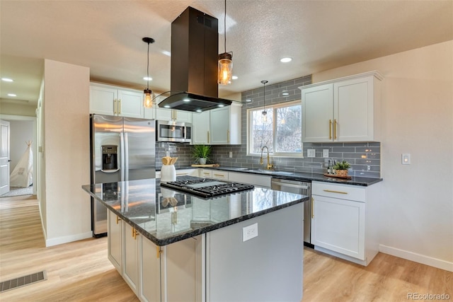 kitchen with visible vents, appliances with stainless steel finishes, light wood-style flooring, and island range hood