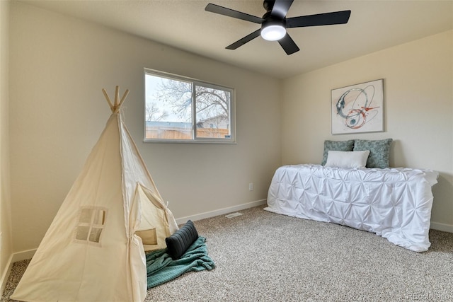 carpeted bedroom featuring visible vents, baseboards, and ceiling fan