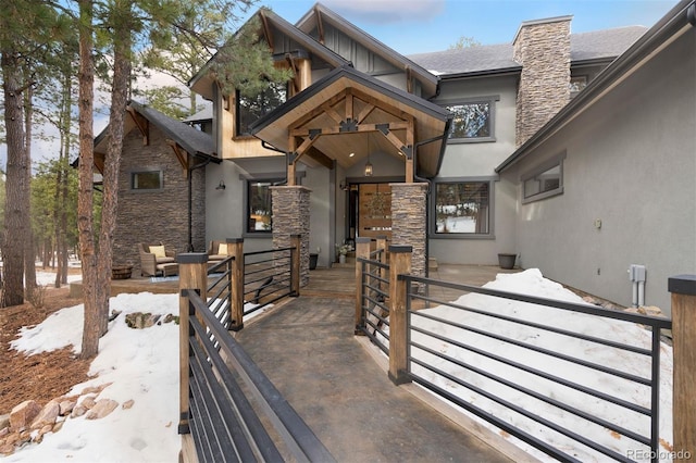 view of snow covered property entrance