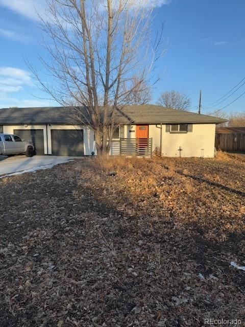 single story home featuring a garage