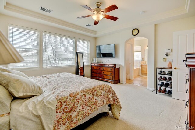 17613 E Peakview Ave, Aurora, CO 80016 - bedroom with light colored carpet, visible vents, a raised ceiling, and arched walkways