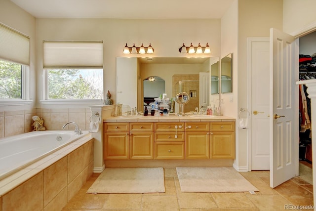 17613 E Peakview Ave, Aurora, CO 80016 - full bath with double vanity, a garden tub, a stall shower, and a sink