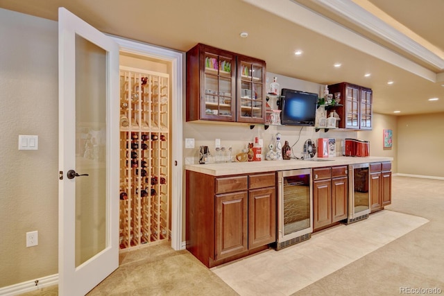 17613 E Peakview Ave, Aurora, CO 80016 - bar featuring light carpet, wet bar, and beverage cooler