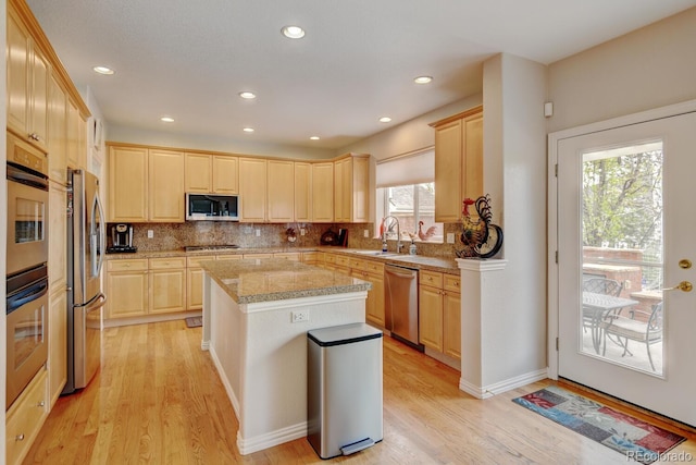 17613 E Peakview Ave, Aurora, CO 80016 - kitchen with a sink, stainless steel appliances, light brown cabinetry, and light wood-style flooring