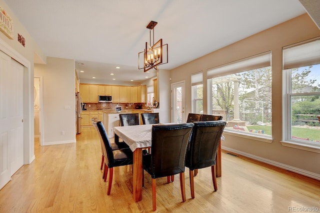 17613 E Peakview Ave, Aurora, CO 80016 - dining space featuring visible vents, baseboards, light wood-style floors, a chandelier, and recessed lighting