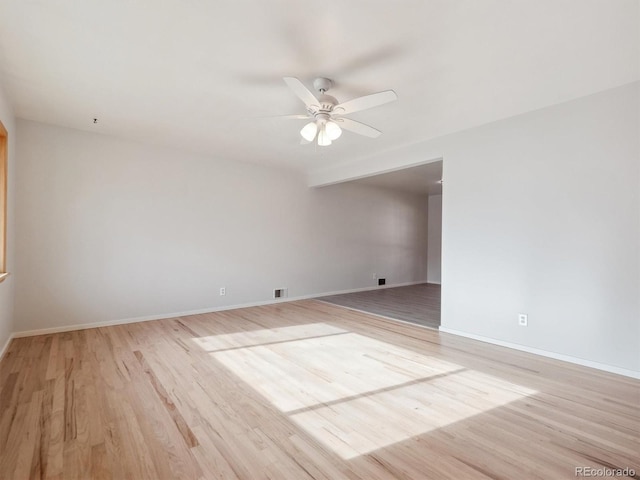 unfurnished room featuring light wood-type flooring and ceiling fan